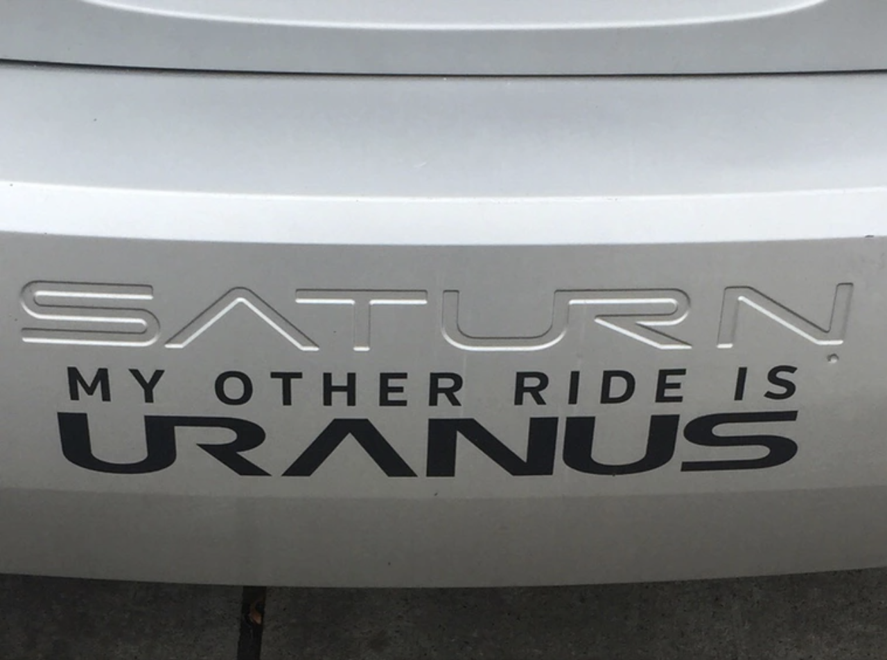 sticker on a Saturn that reads &quot;my other ride is uranus&quot;