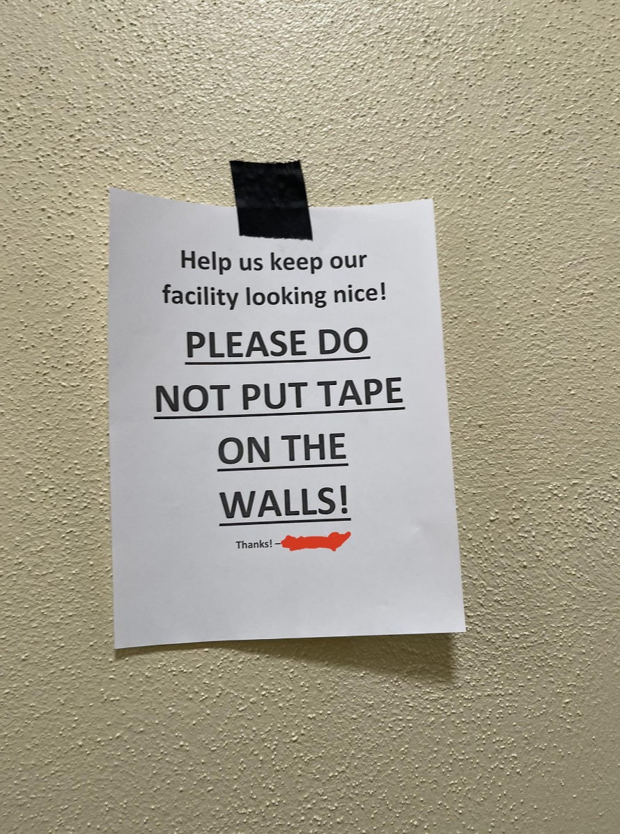 Taped sign on school wall: &quot;PLEASE DO NOT PUT TAPE ON THE WALLS!&quot;