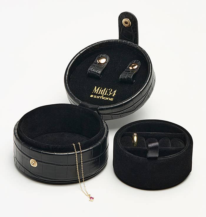 the jewellery case open with a couple of pieces in it