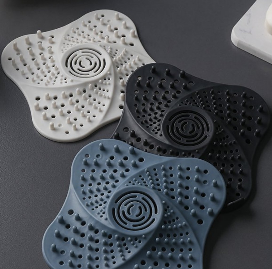 a set of three silicone drain covers