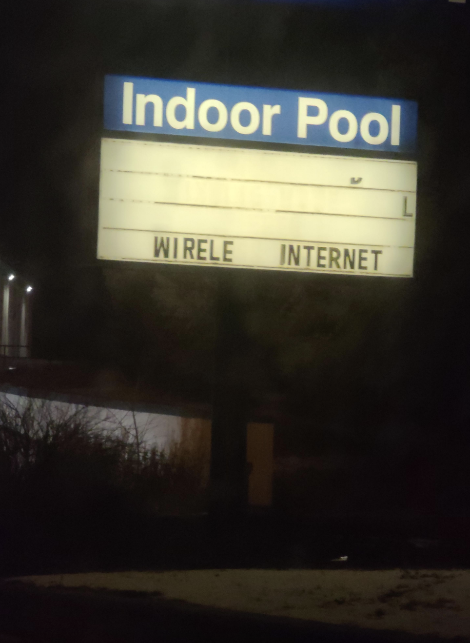 Sign for indoor pool that reads, &quot;WIRELE INTERNET&quot;