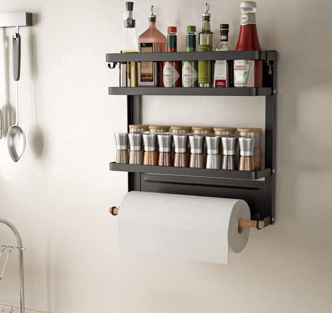a spice rack shelf with a paper towel roll holder mounted to a roll