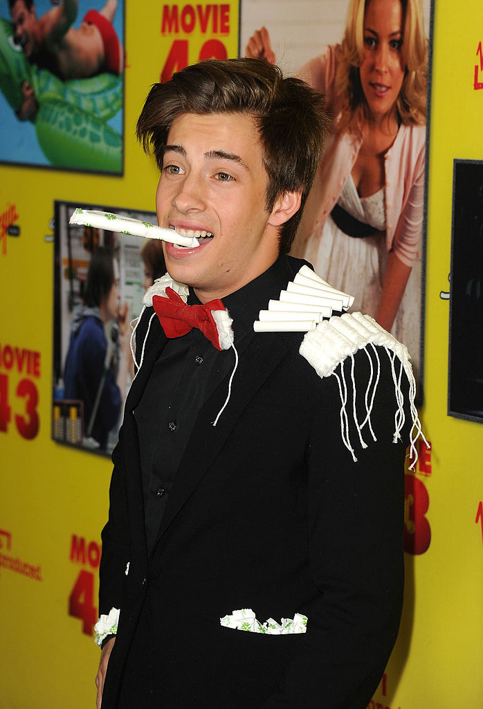 jimmy with tampons attached to his suit jacket