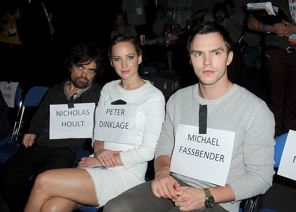 Jennifer and Nicholas sitting with Peter Dinklage and wearing each other&#x27;s name tag