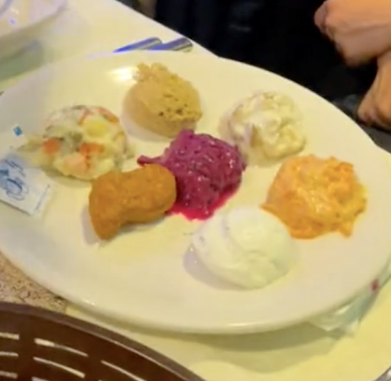 Different "dips" on a plate next to the nugget, different colors and textures