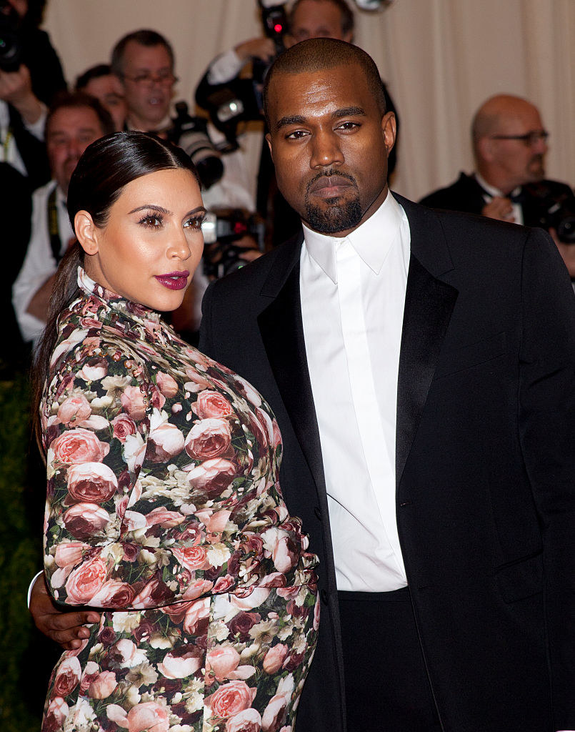 A pregnant Kim with Ye
