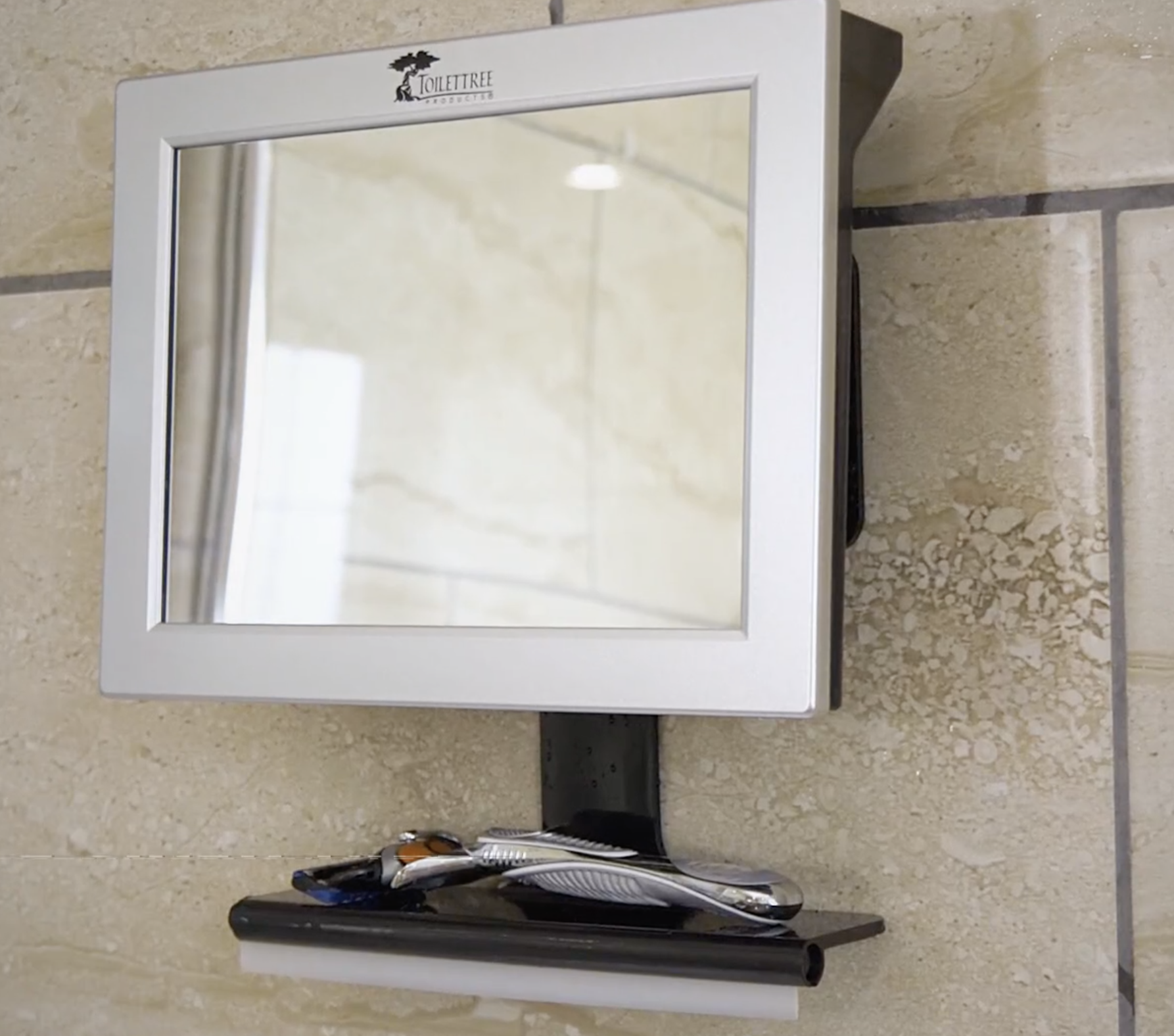 the mirror attached to a shower wall
