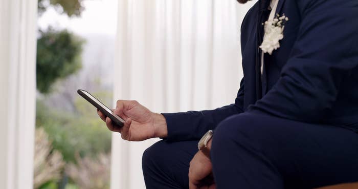 A groom on his phone