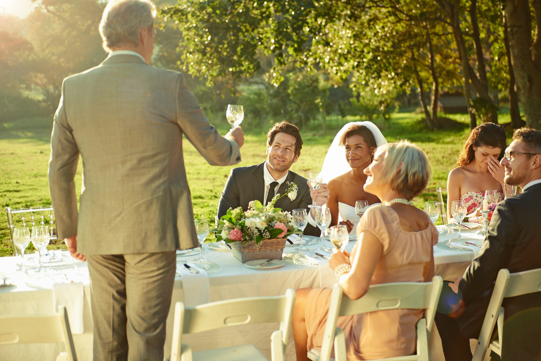 A man giving a toast at a wedding