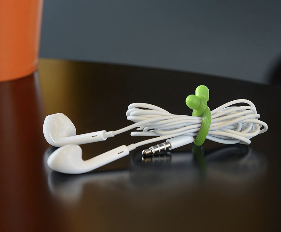 the twist tie being used to hold headphones together