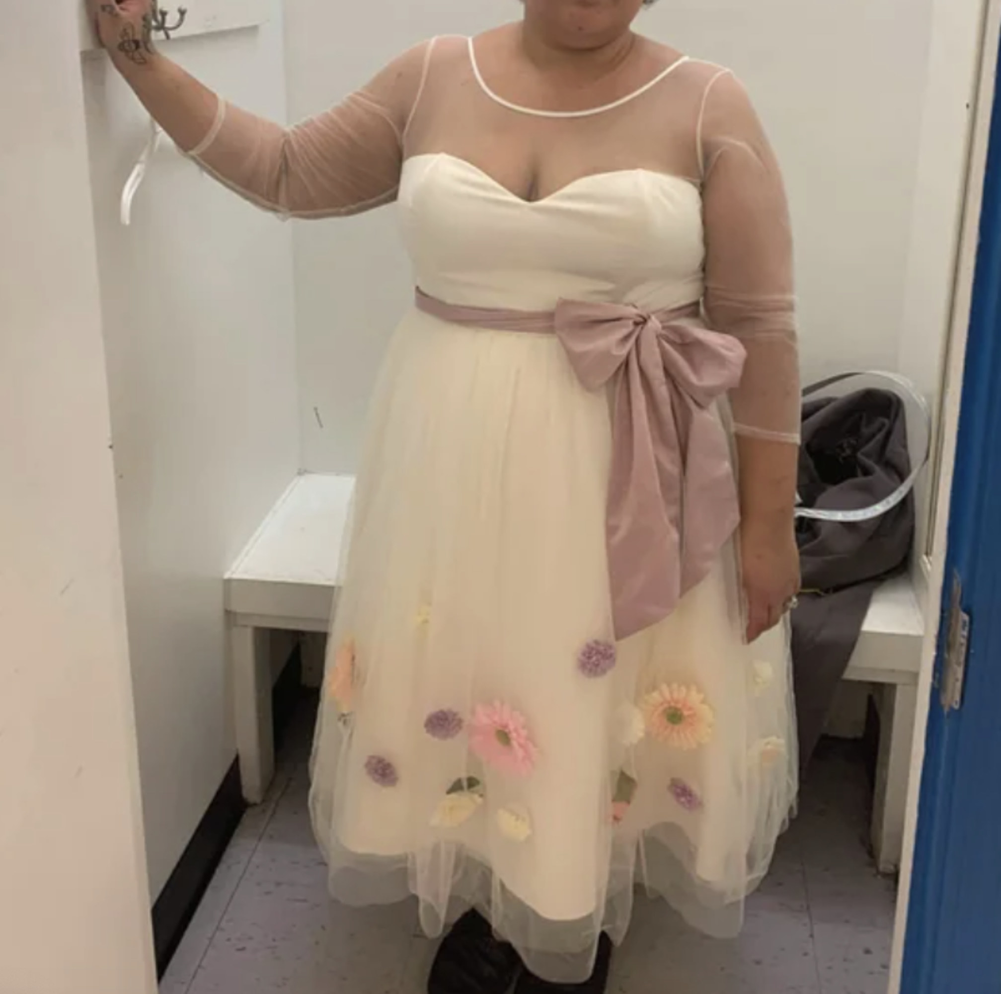 A woman trying on a wedding dress