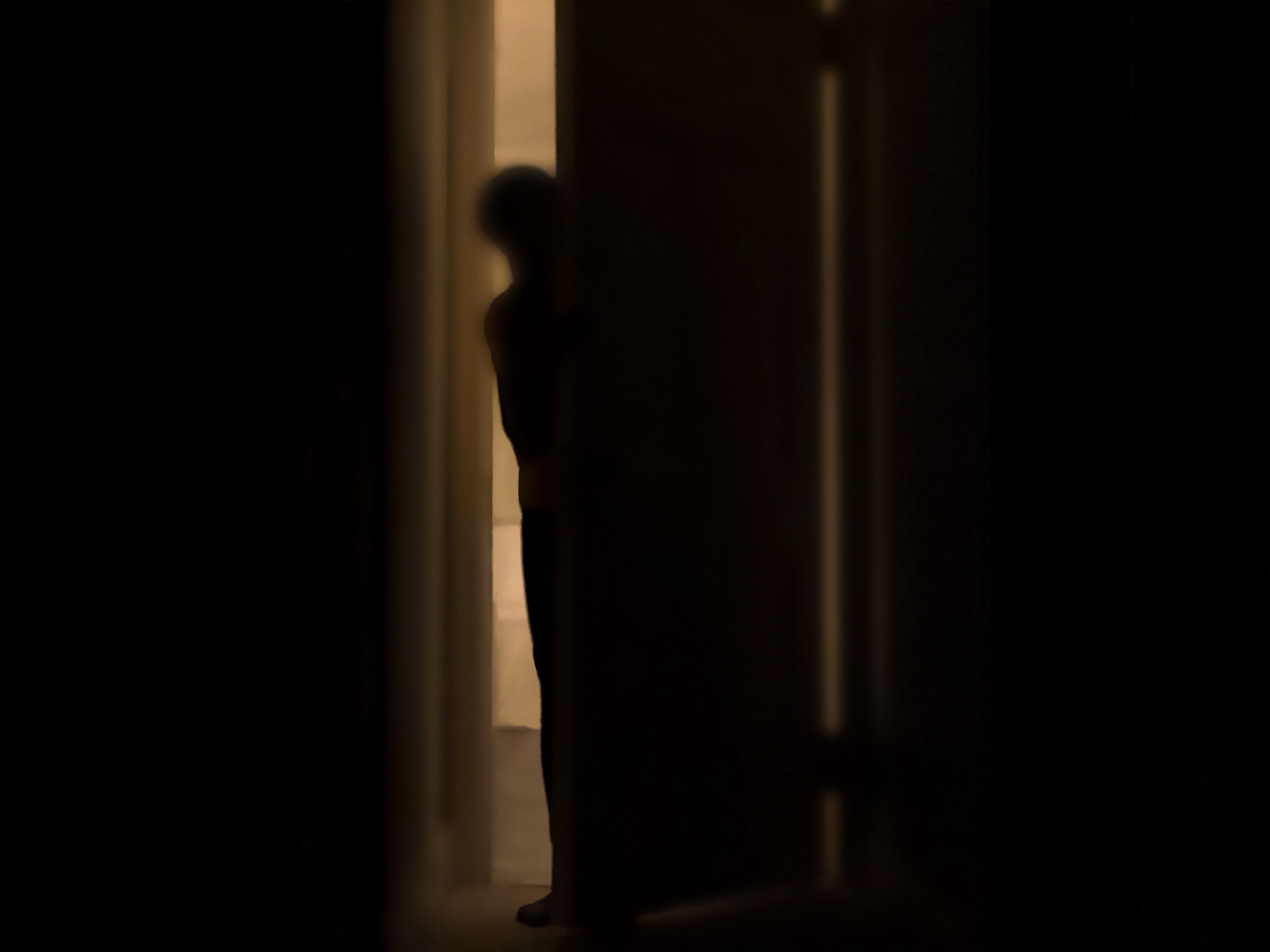 figure opening the door