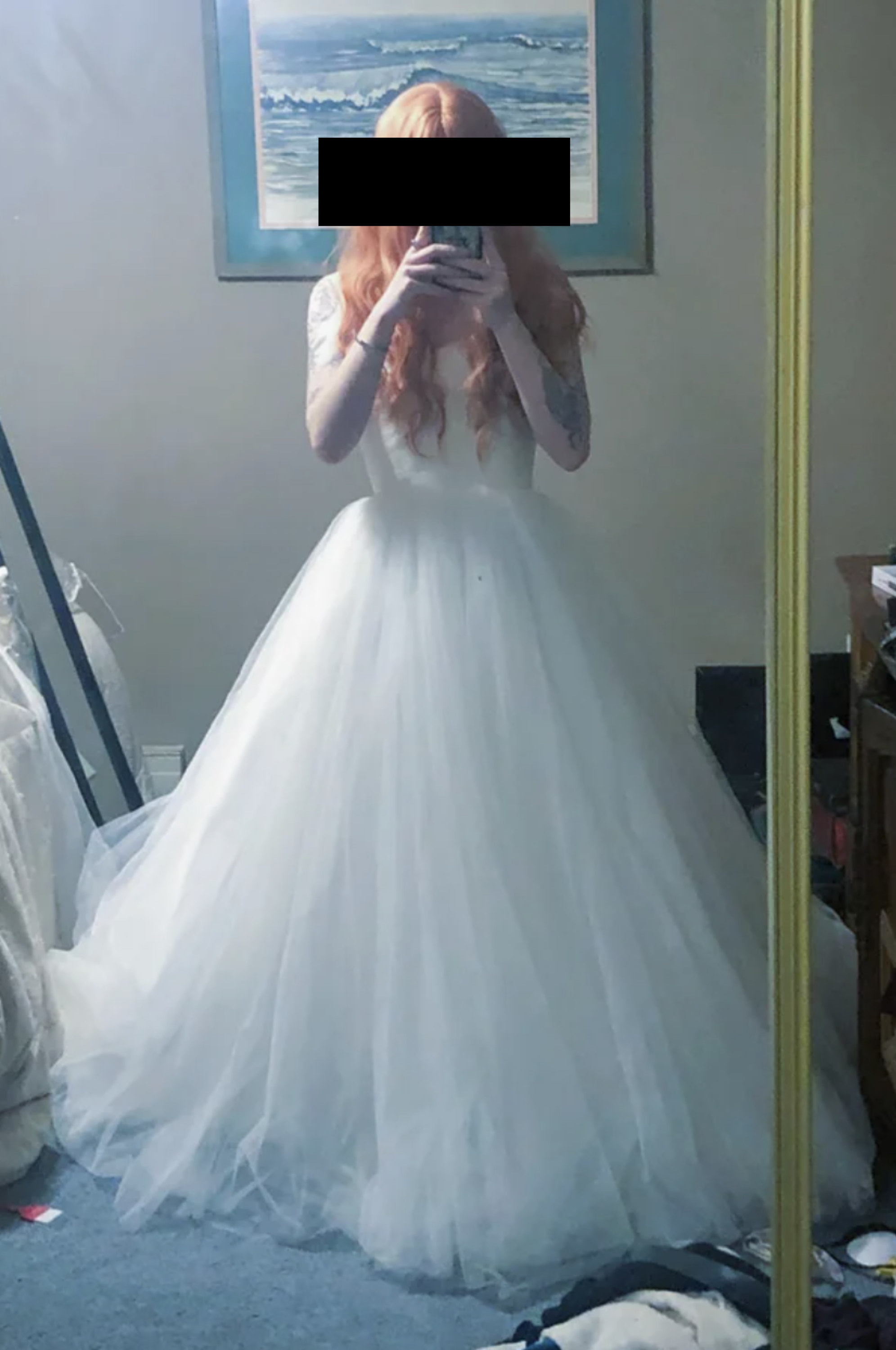 A woman trying on a wedding dress