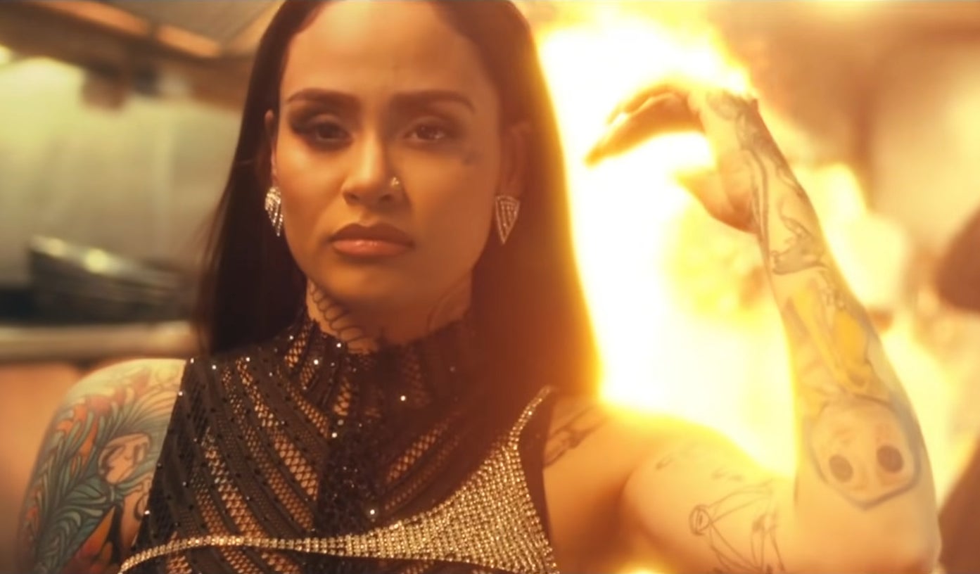 Kehlani walking away from a burning fire in "Good Thing" music video