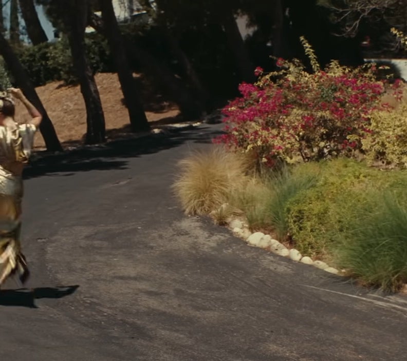 Miley Cyrus dancing up a driveway in &quot;Flowers&quot;