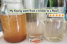reviewer photo of the water that came out of their keurig after using the k-cup cleaning pod and you can see that the original brown water gets cleaner and clearer after each cycle of using the cleaning cup