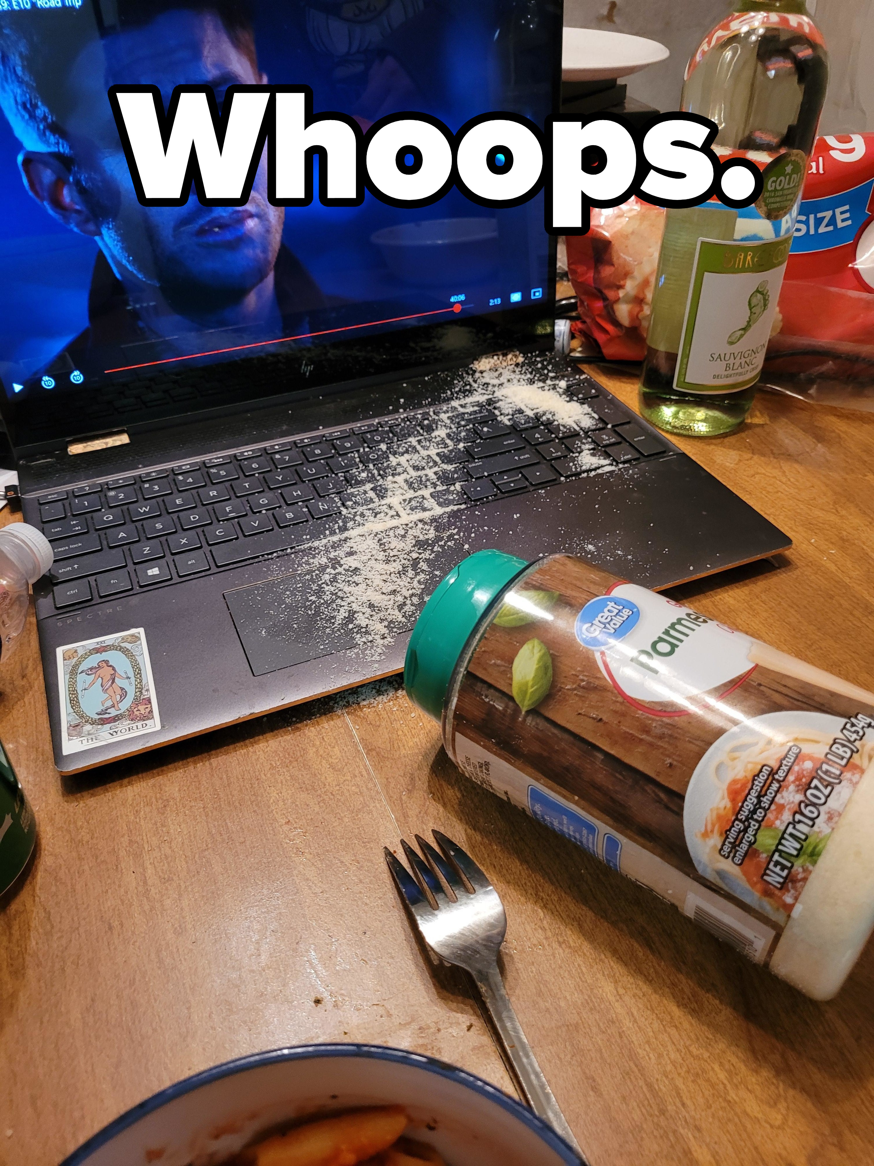 Parmesan cheese spilled on a laptop