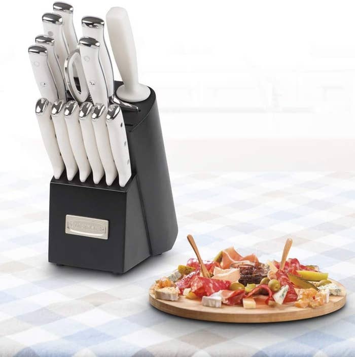 the knife block next to a charcuterie board