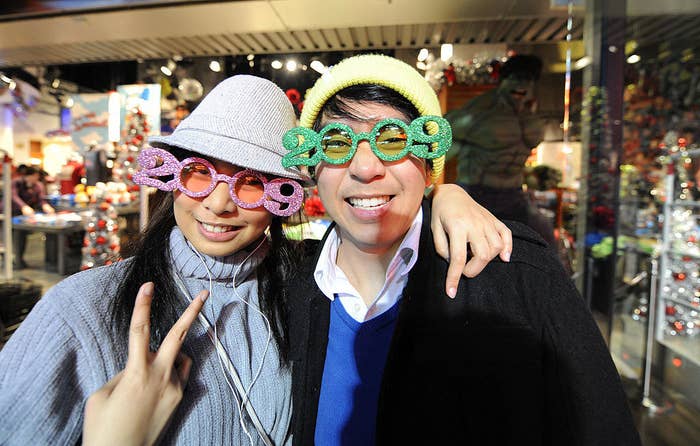 Two people wearing glasses that read 2009