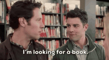 paul rudd as joel in they came together say i&#x27;m looking for a book while standing next to max greenfield in a book store