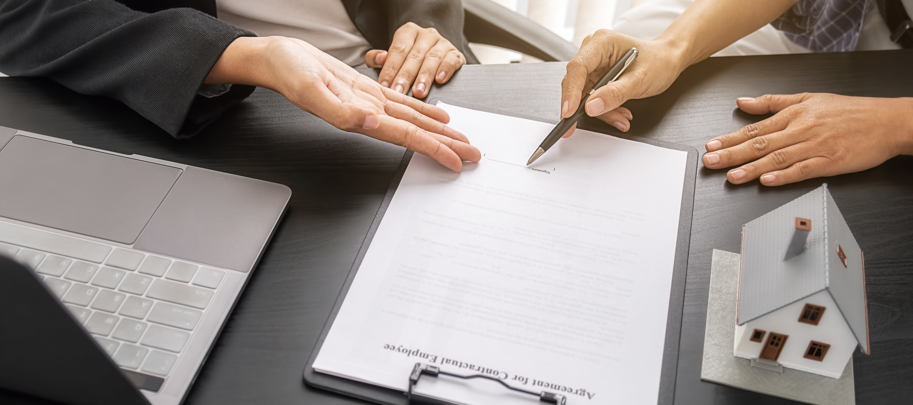 a person signing a contract