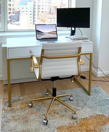 Reviewer's chair is shown in front of a desk