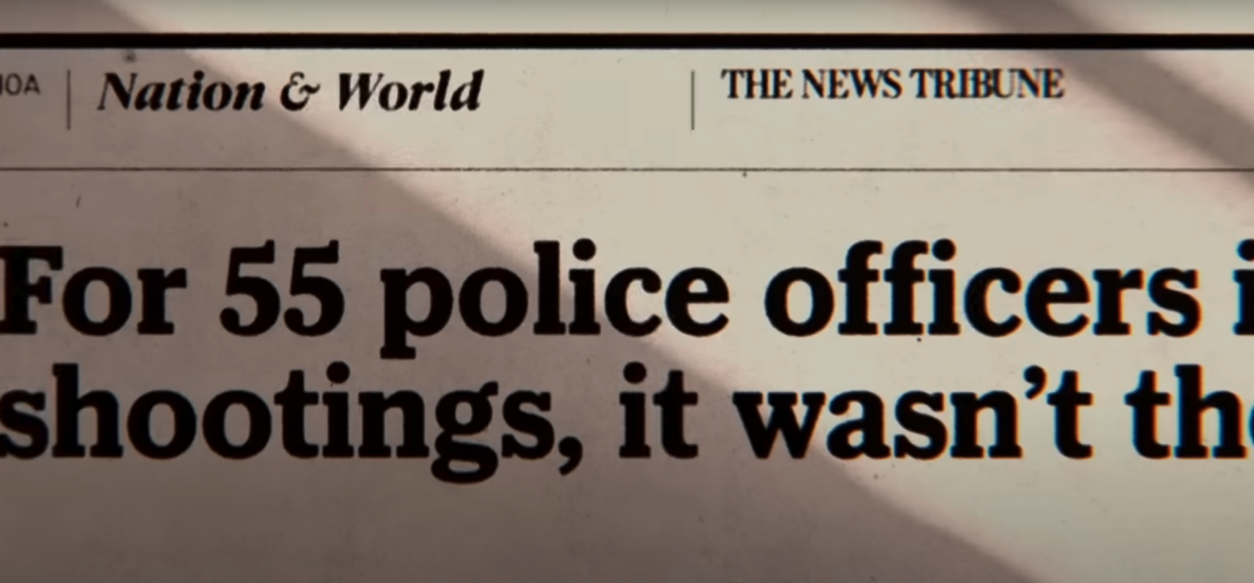 Cut off newspaper heading reads &quot;For 55 police officers... shootings, it wasn&#x27;t&quot;