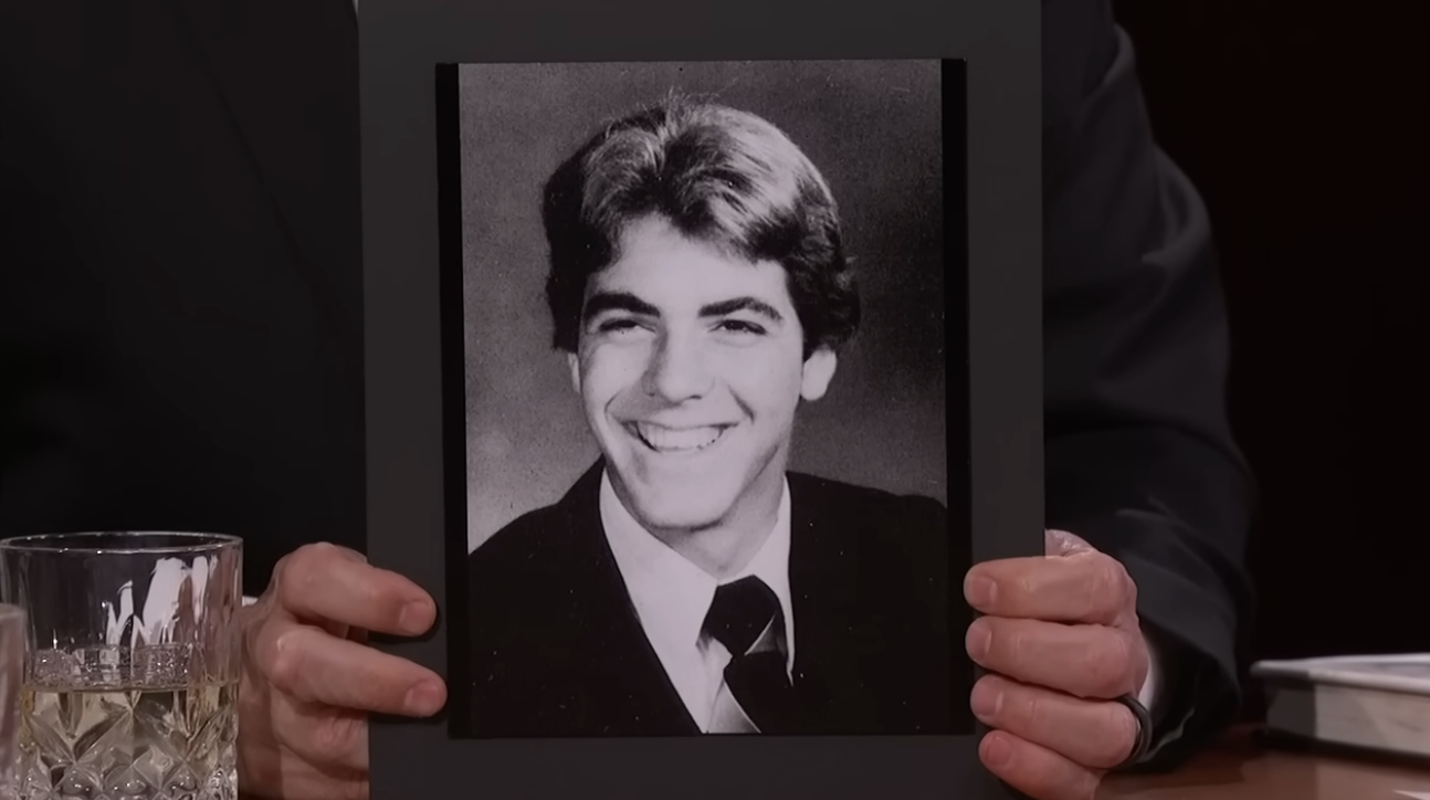 george smiling big with shorter hair