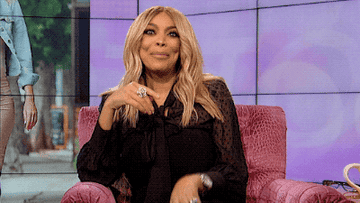 wendy williams covering her laugh with her hand