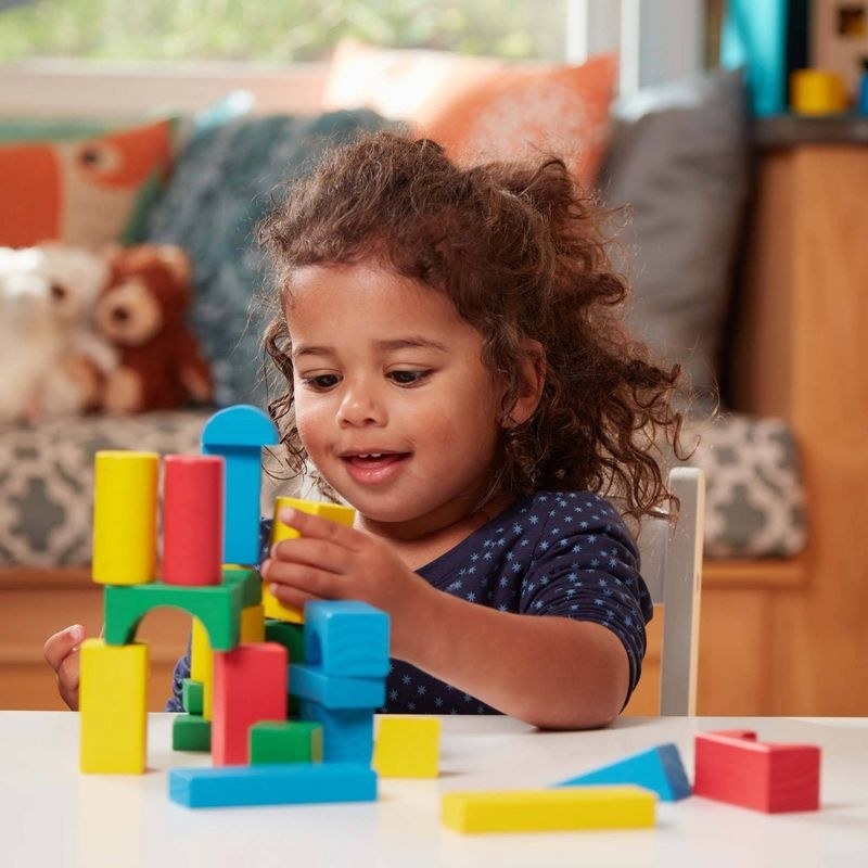 Child plays with blocks