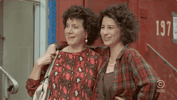 the above actors hugging in broad city