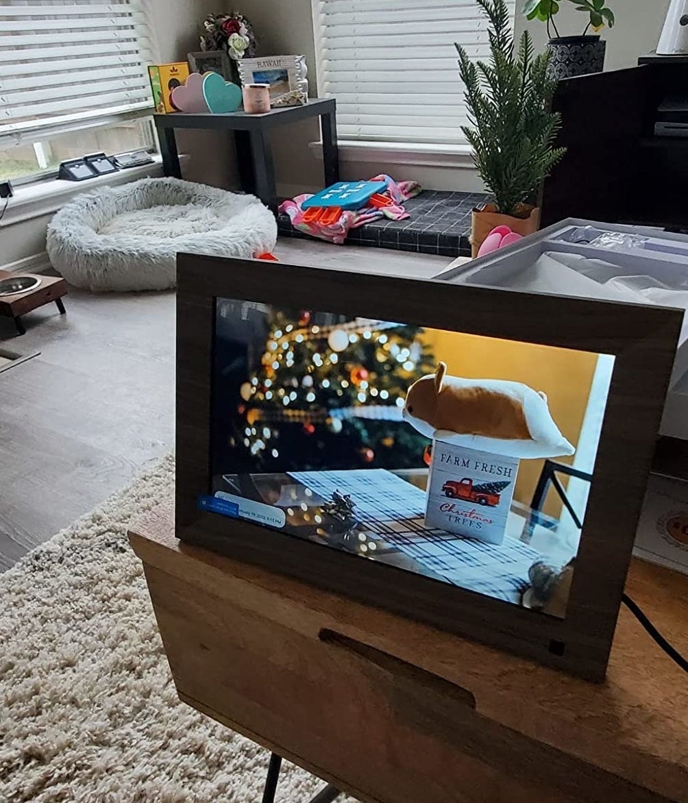 the faux-wood digital frame displaying holiday photo