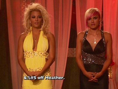 two women stand next to each other, wearing gowns, and one says &quot;fuck off, heather&quot;
