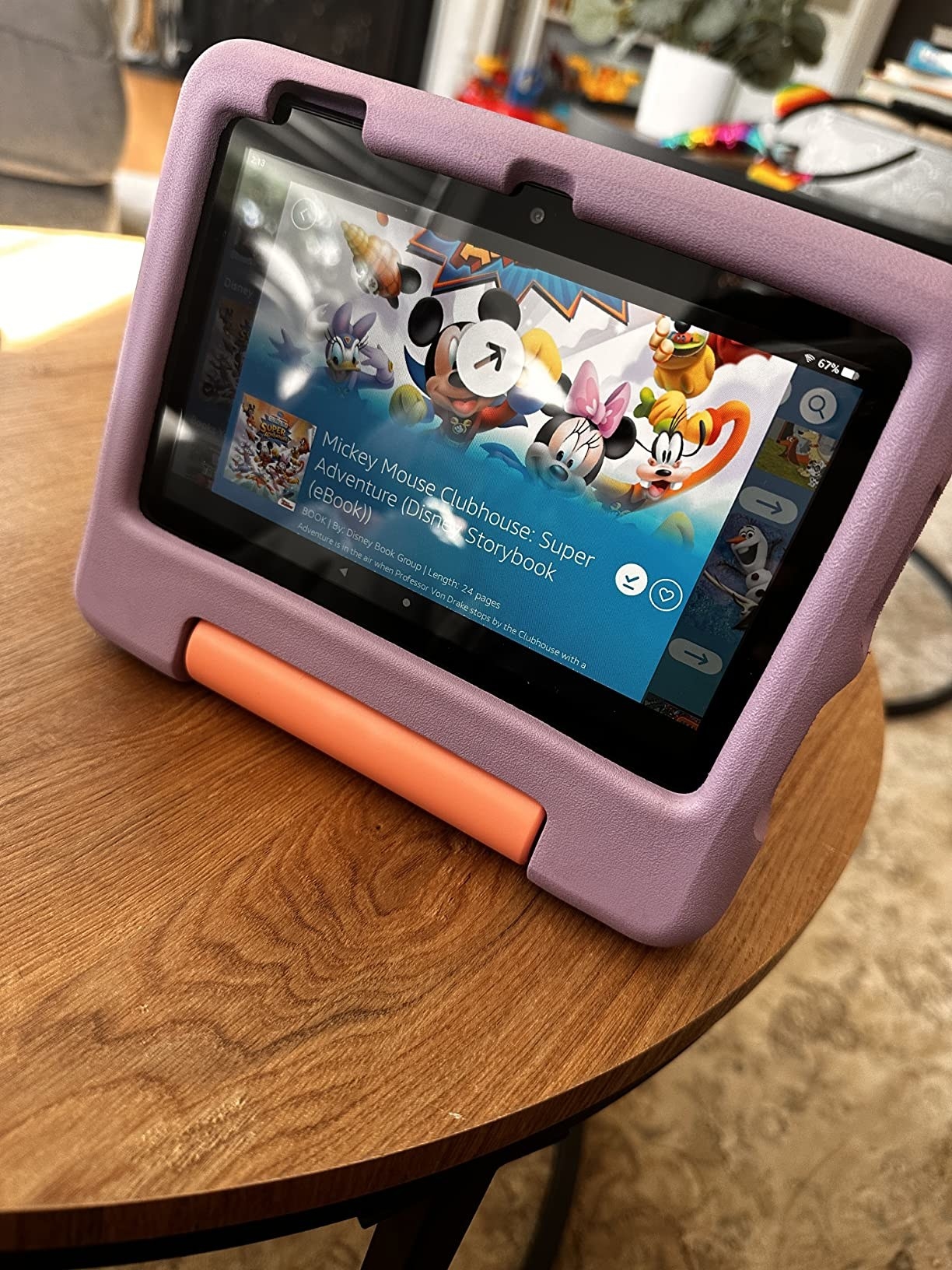 A purple amazon fire tablet with disney tv show on screen