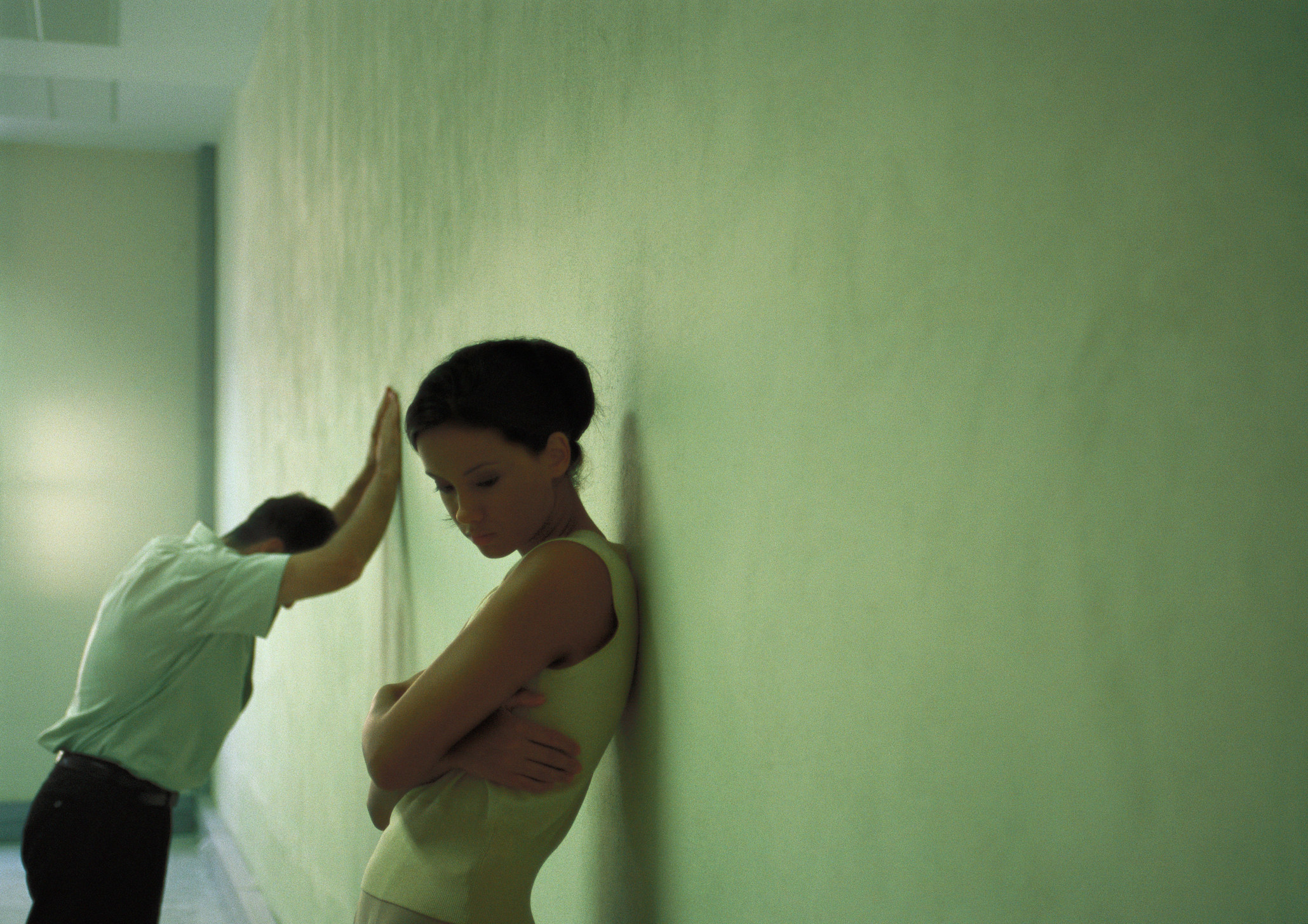 A couple arguing in a hallway