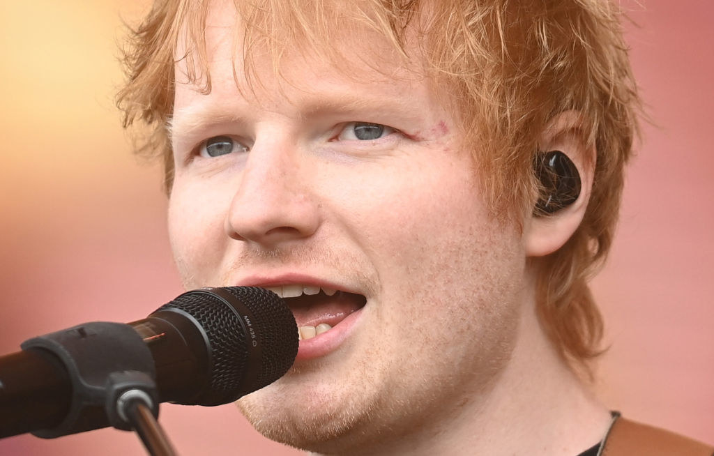 A closeup of Ed performing onstage