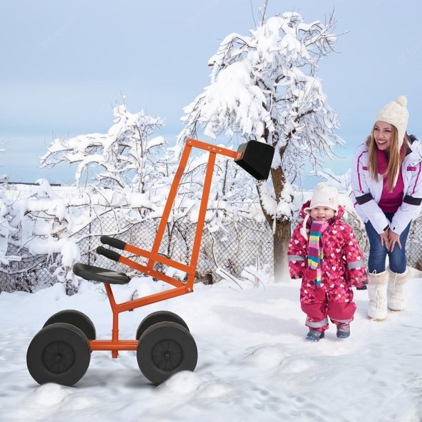 Excavator in snow with kid and parent