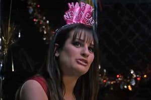 Lea Michele wearing a happy new year headband as Elise in New Year's Eve