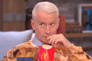Anderson Cooper eating some McDonald's fries