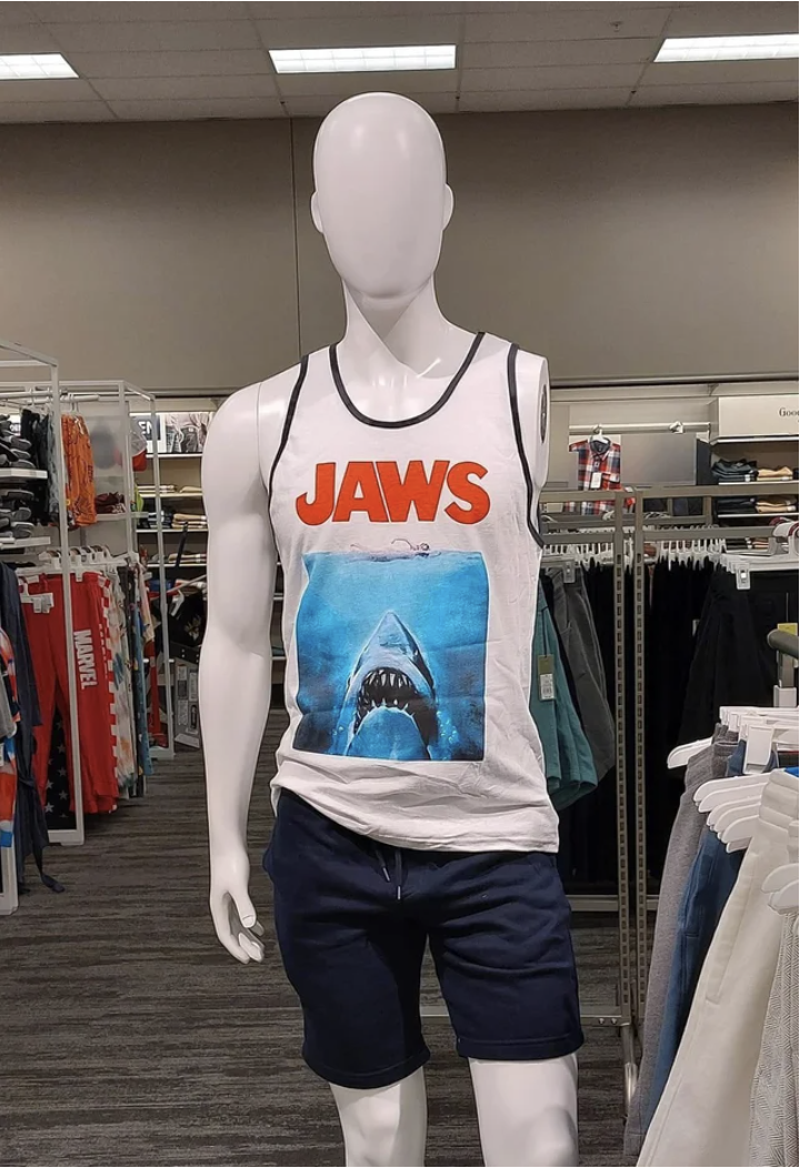 A mannequin missing an arm and wearing a &quot;Jaws&quot; shirt