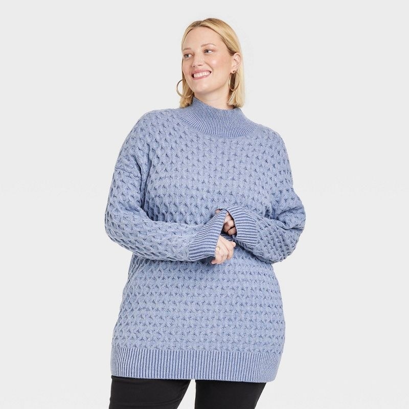 Model wearing periwinkle knit sweater