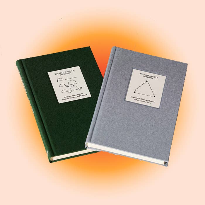 green and gray guided therapy notebooks designed to help with anxiety and depression