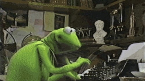 Frog typing on typewriter