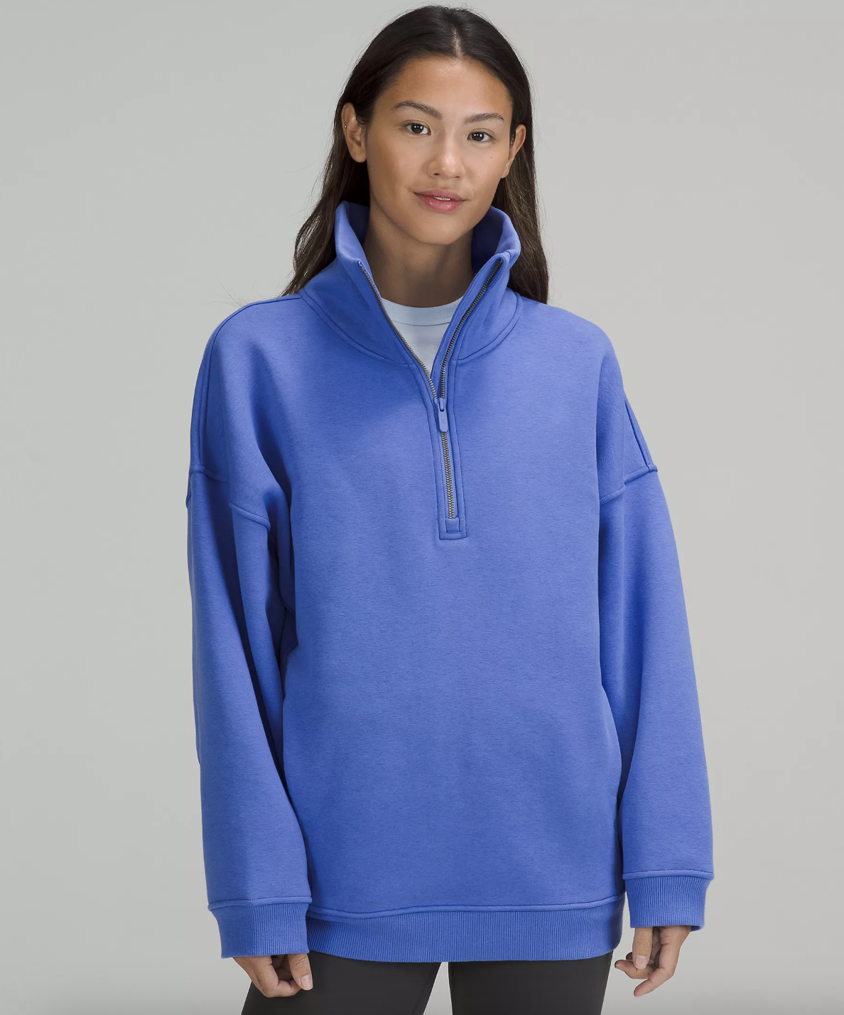 a person wearing the fleece half zip sweatshirt