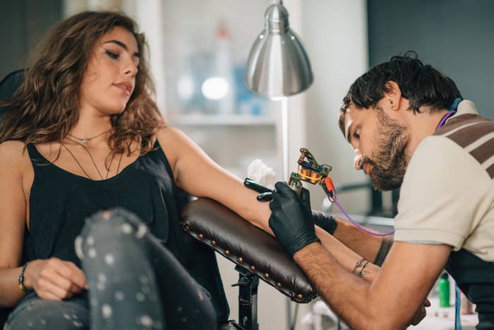 A woman getting a tattoo