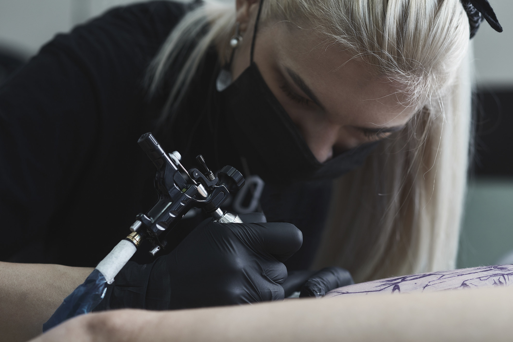 A tattoo artist at work