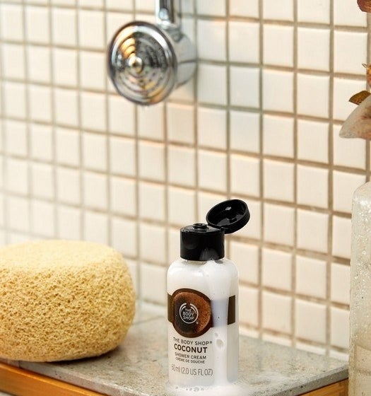 The shower cream covered in suds in a shower