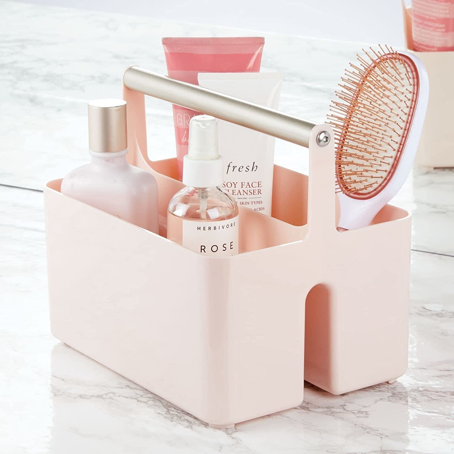 a pastel hued shower caddy filled with personal care products