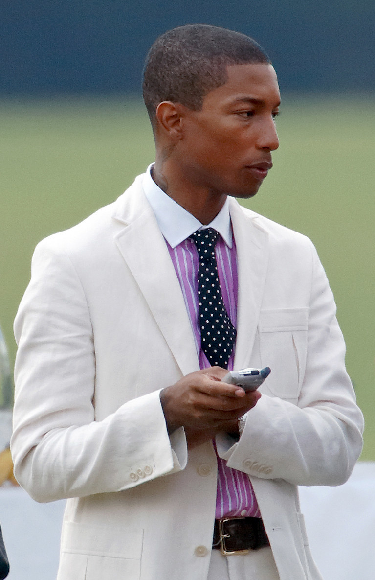 Pharrell on his phone