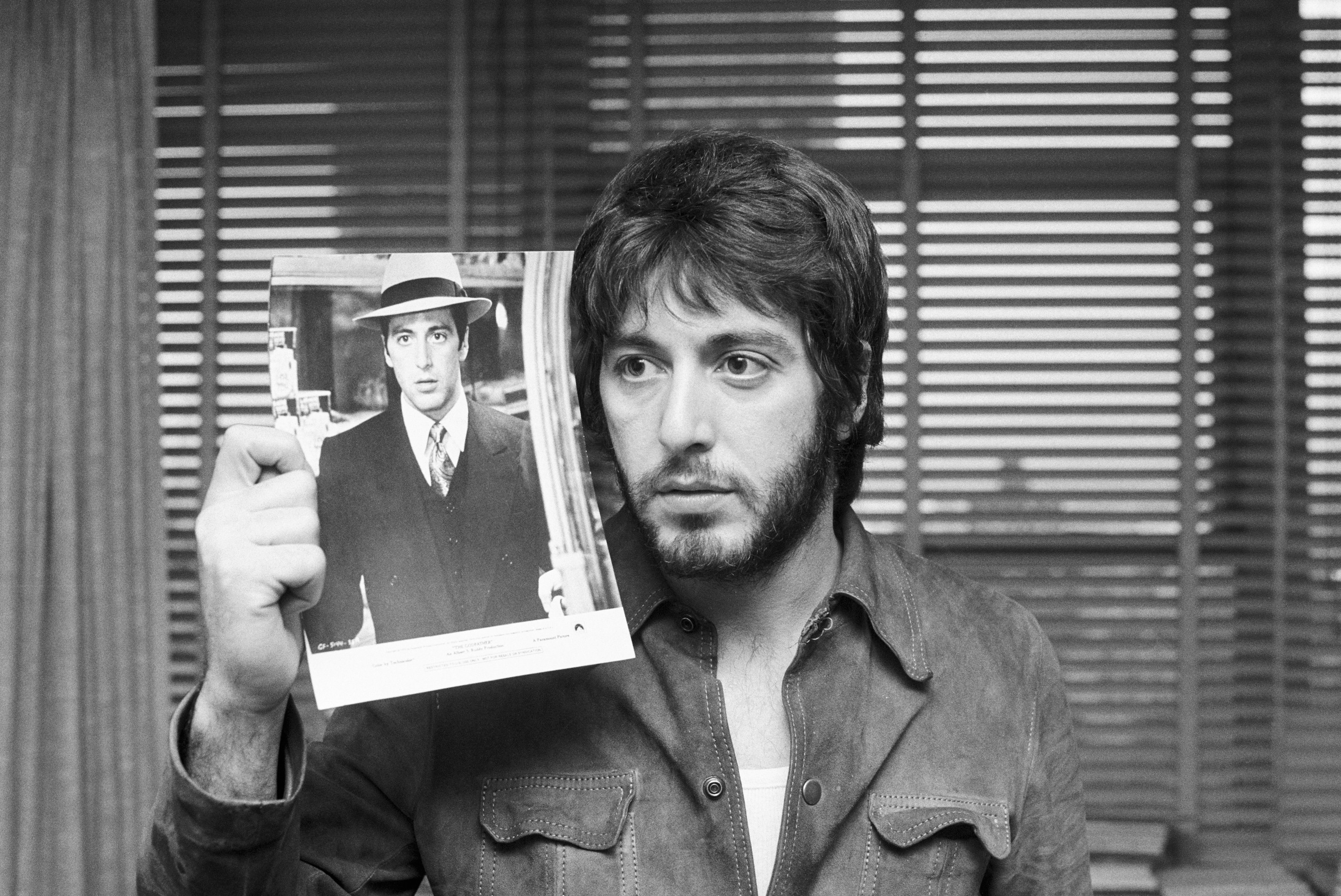 Al Pacino holding a photo of himself